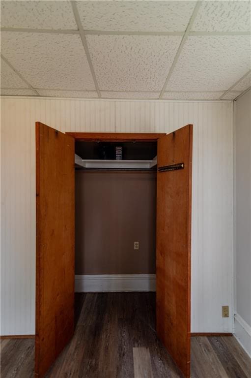 713 N 13th St, Atchison, KS 66002 - unfurnished bedroom with wood finished floors and a drop ceiling