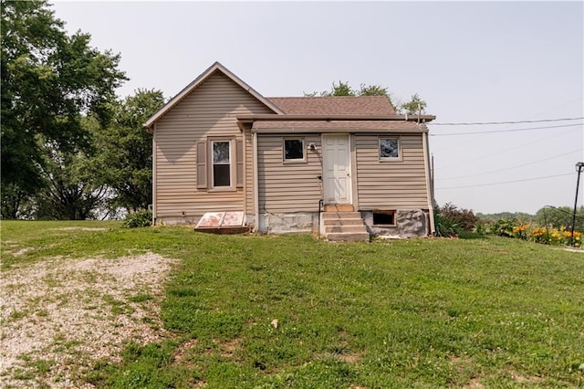 713 N 13th St, Atchison, KS 66002 - rear view of house with entry steps and a lawn