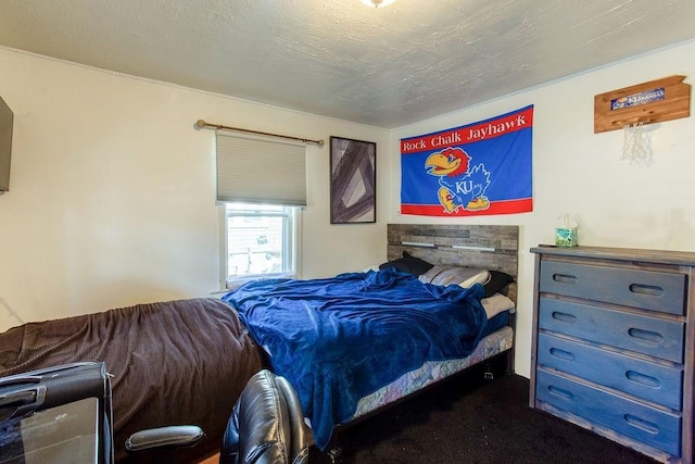 carpeted bedroom with a textured ceiling