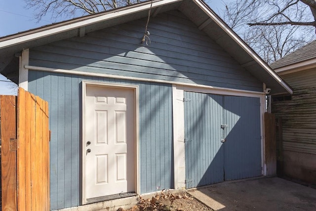 view of shed with fence