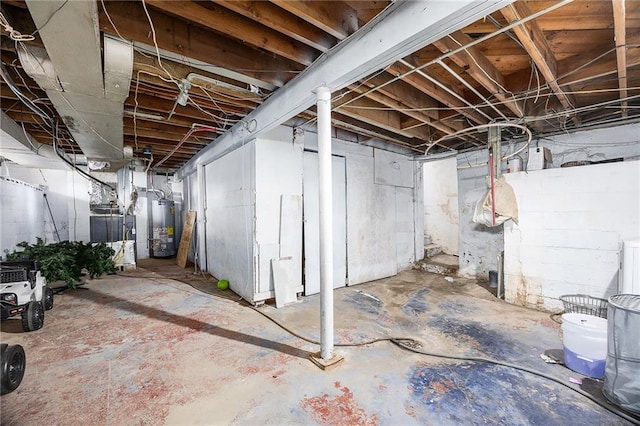 unfinished basement with gas water heater