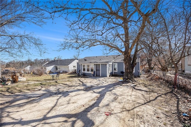 back of house featuring fence