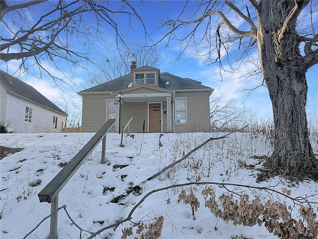 view of front of home with a chimney