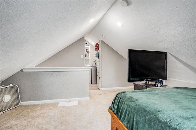 bedroom with baseboards, a textured ceiling, lofted ceiling, and carpet