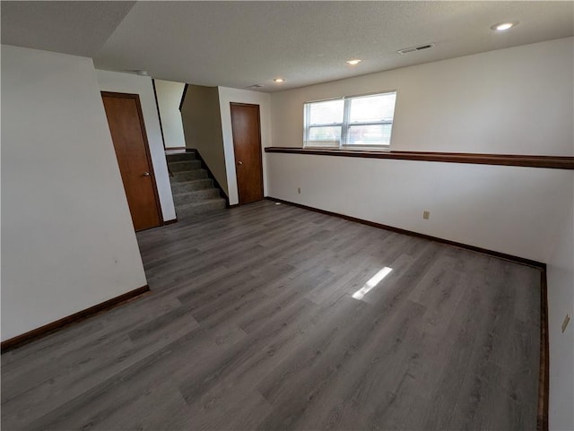 1900 SE 6th Ter, Lees Summit, MO 64063 - basement featuring stairway, baseboards, wood finished floors, and recessed lighting