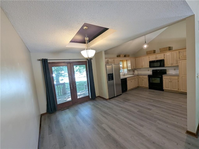 1900 SE 6th Ter, Lees Summit, MO 64063 - kitchen with black appliances, french doors, a textured ceiling, baseboards, and light countertops