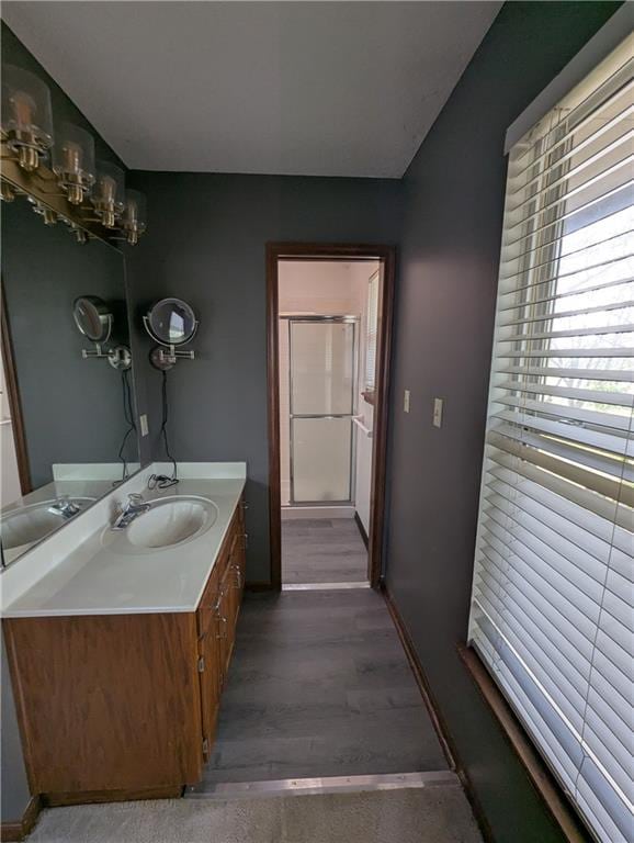 1900 SE 6th Ter, Lees Summit, MO 64063 - bathroom with vanity, wood finished floors, and a shower