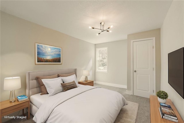 bedroom with baseboards, carpet, and an inviting chandelier