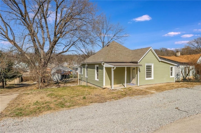 view of front of house featuring roof with shingles