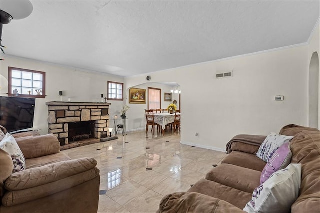 living area with visible vents, baseboards, arched walkways, a textured ceiling, and marble finish floor