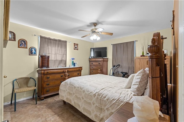 bedroom with baseboards and a ceiling fan