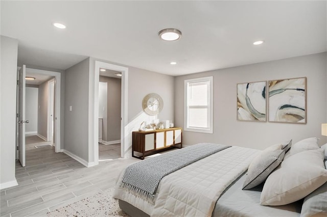 bedroom with recessed lighting, baseboards, and light wood finished floors