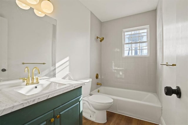 full bathroom featuring shower / bath combination, toilet, vanity, and wood finished floors