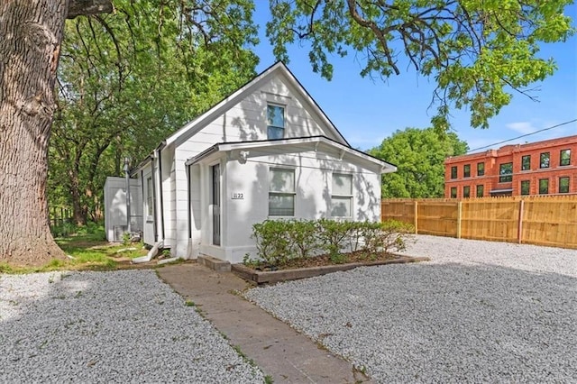 view of front of home with fence