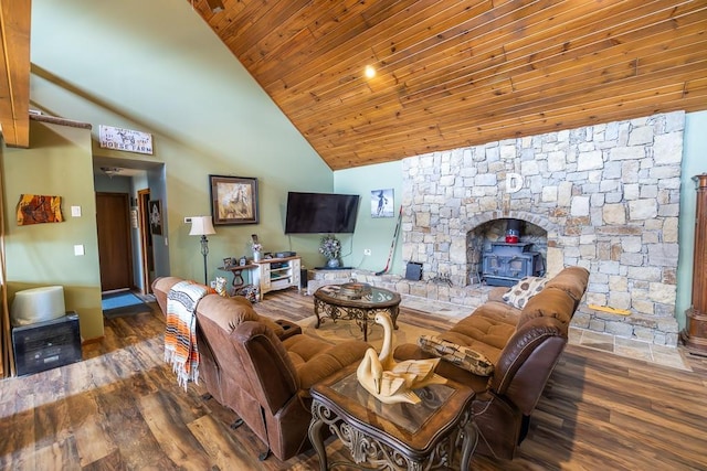 living room with wood ceiling, wood finished floors, a wood stove, and high vaulted ceiling