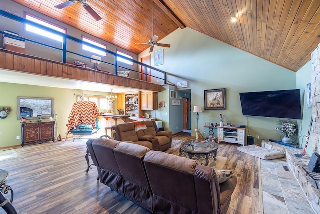 living area featuring high vaulted ceiling, ceiling fan with notable chandelier, wood finished floors, wooden ceiling, and baseboards