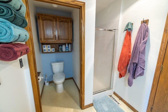 bathroom with visible vents, baseboards, toilet, and a shower stall