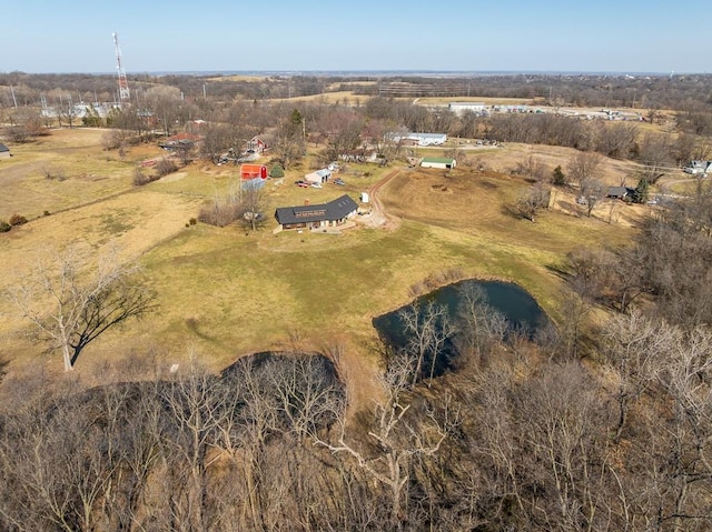 birds eye view of property with a rural view