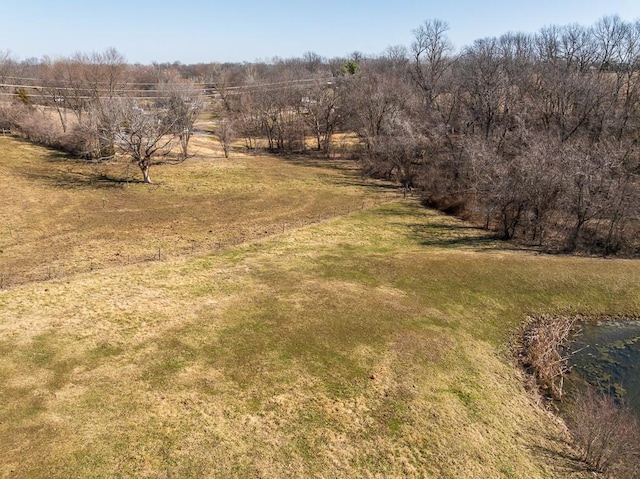 birds eye view of property with a rural view