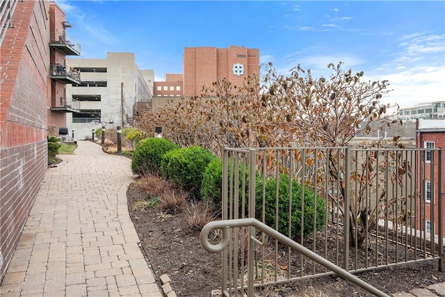 view of community featuring fence