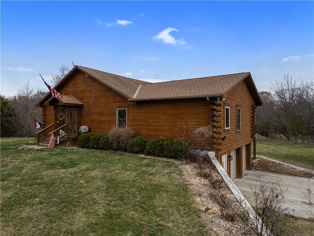 view of side of home featuring concrete driveway, log exterior, a lawn, and a garage