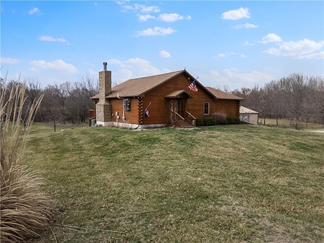 view of home's exterior with a lawn and a chimney