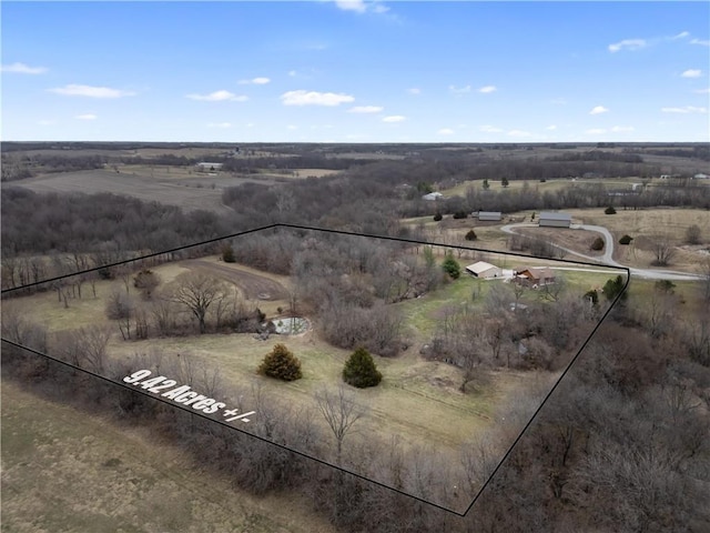 birds eye view of property featuring a rural view