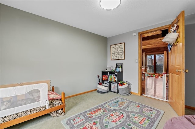 bedroom featuring baseboards and carpet floors