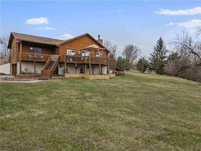 back of property with stairway, log siding, a chimney, a deck, and a lawn