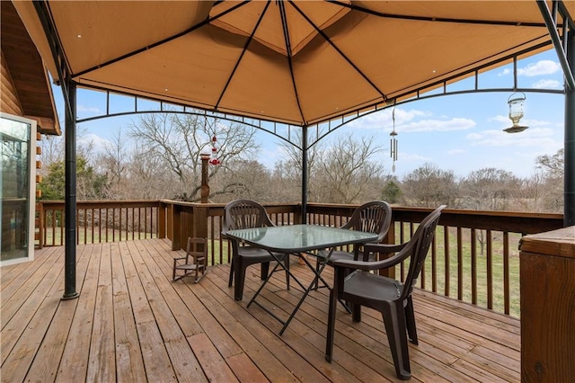 wooden deck with outdoor dining area