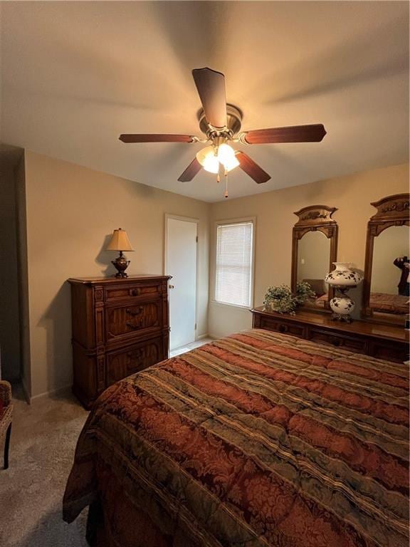 carpeted bedroom featuring ceiling fan