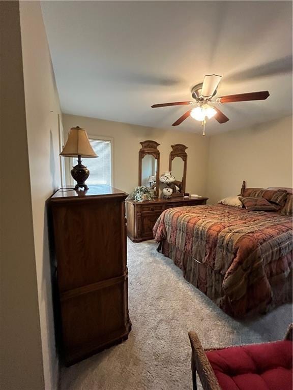 bedroom with a ceiling fan and carpet floors