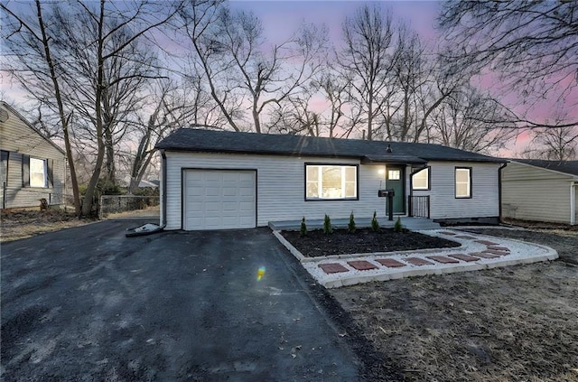 view of front of property with a garage and driveway