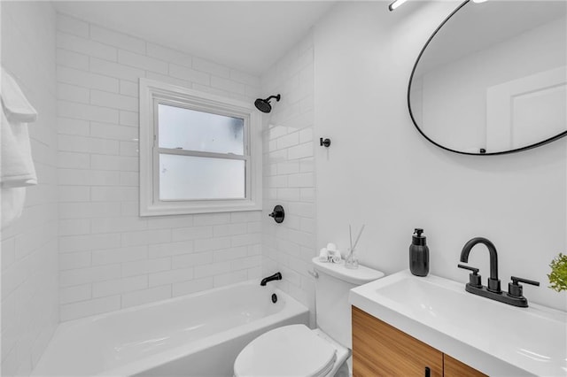 bathroom featuring vanity, toilet, and washtub / shower combination