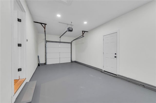 garage featuring recessed lighting and a garage door opener