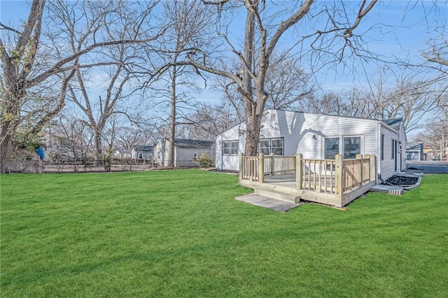 view of yard with fence and a wooden deck