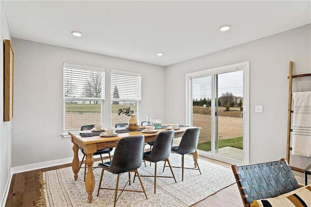 dining area with light wood-style flooring, recessed lighting, and baseboards