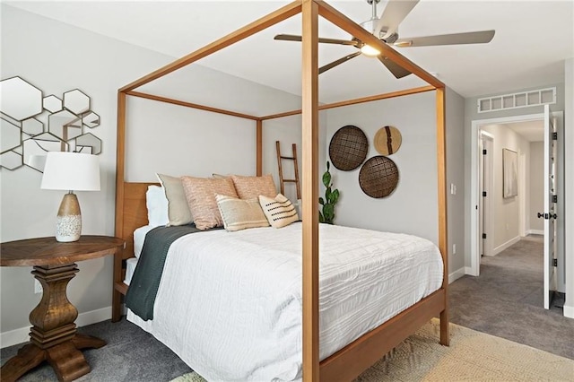 carpeted bedroom with baseboards, visible vents, and ceiling fan