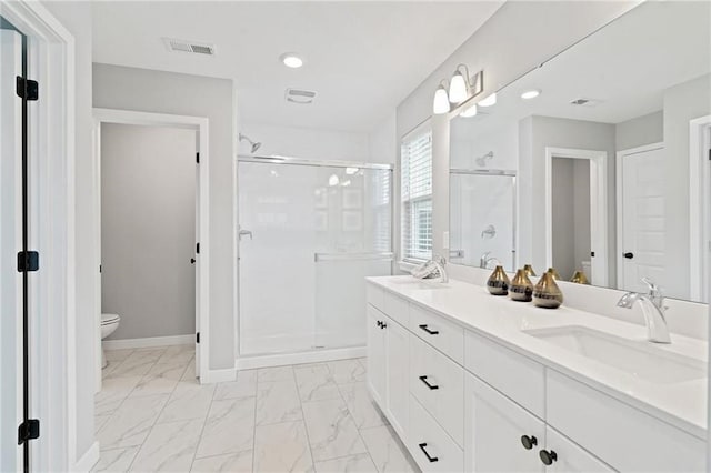 bathroom with visible vents, a stall shower, a sink, toilet, and marble finish floor