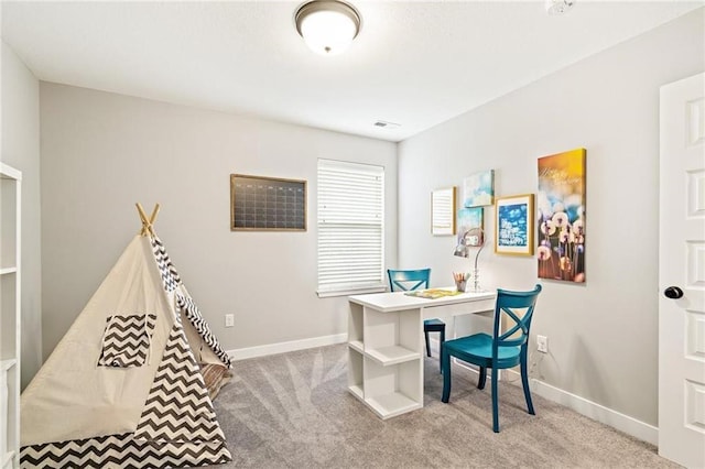 carpeted home office with baseboards