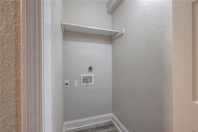 washroom with baseboards, laundry area, hookup for a washing machine, a textured wall, and electric dryer hookup