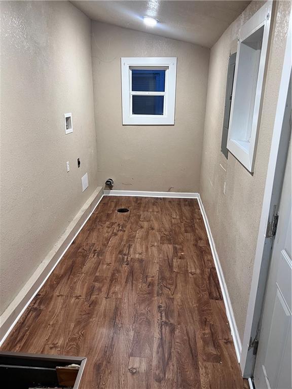 washroom featuring baseboards, laundry area, hookup for a washing machine, wood finished floors, and hookup for an electric dryer