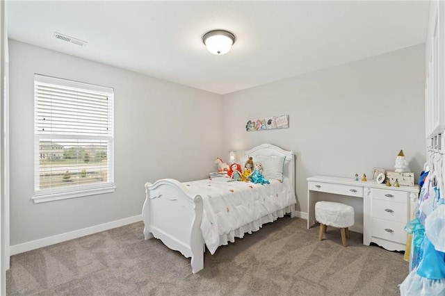 bedroom with visible vents, baseboards, and light colored carpet