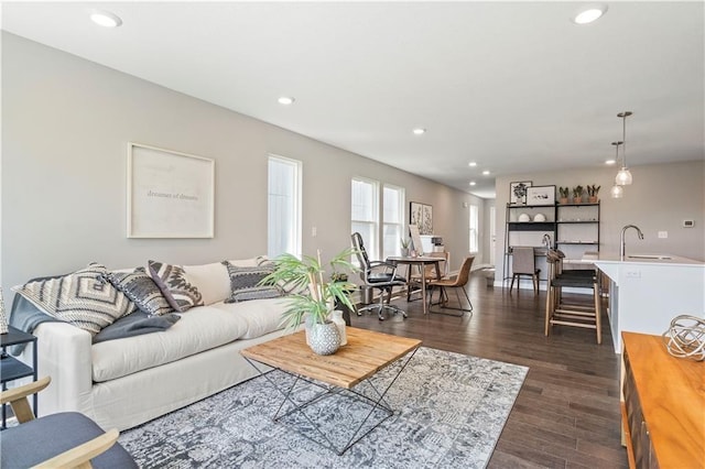 living area with dark wood finished floors and recessed lighting