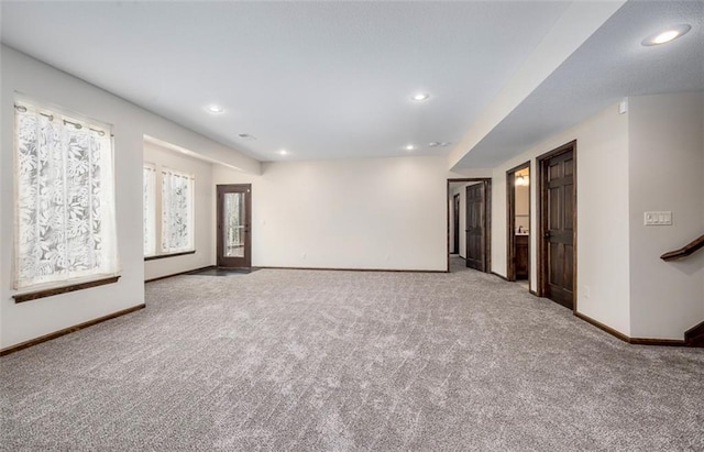 carpeted spare room with recessed lighting and baseboards