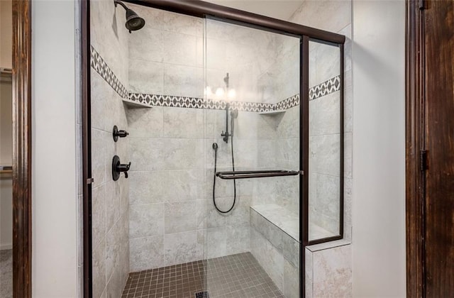 full bath featuring a shower stall