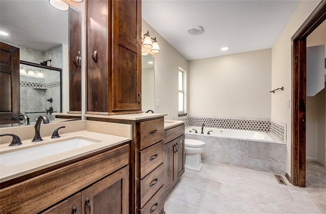 bathroom featuring visible vents, a garden tub, toilet, a shower stall, and vanity