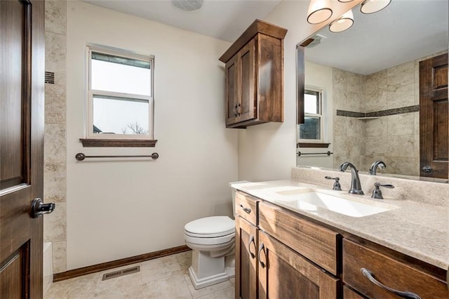 full bathroom with vanity, baseboards, visible vents, a shower, and toilet