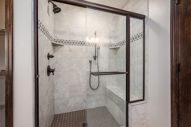 bathroom featuring a shower stall