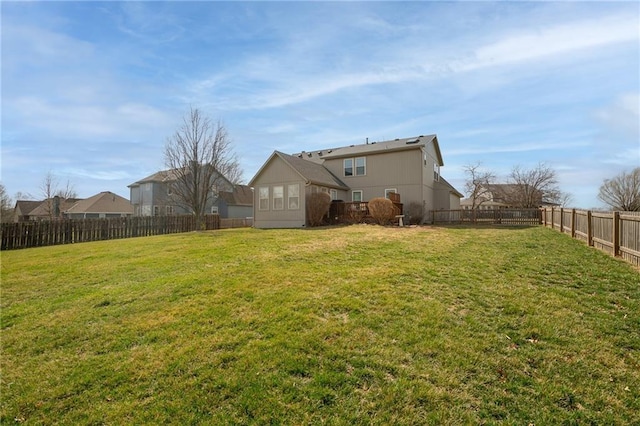 view of yard with a fenced backyard